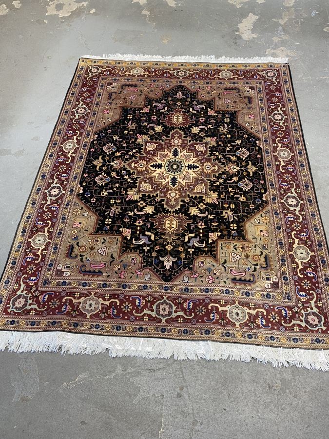 The same Heriz-design rug after shearing, with rich navy and burgundy color