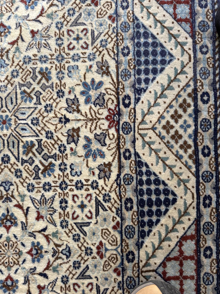 The same rug after washing, with the stain removed
